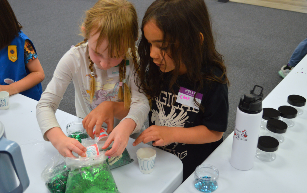 Hands pinning on a Highest Award