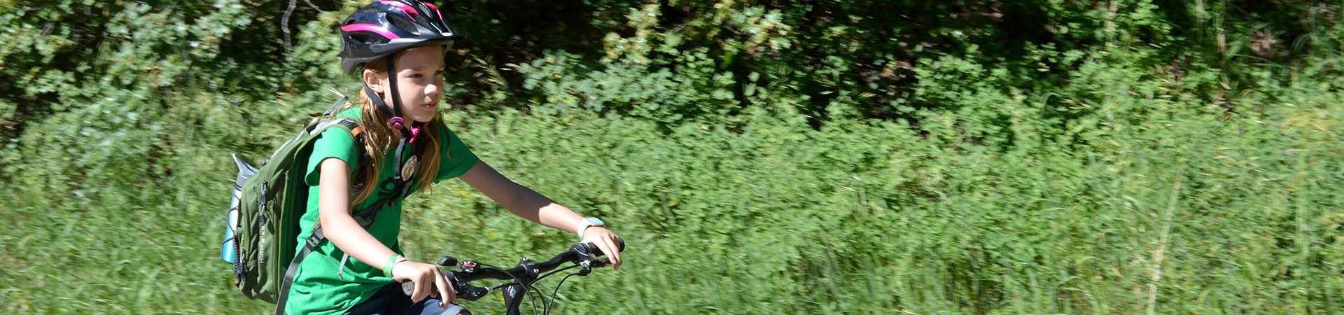  girl scout riding a bike 