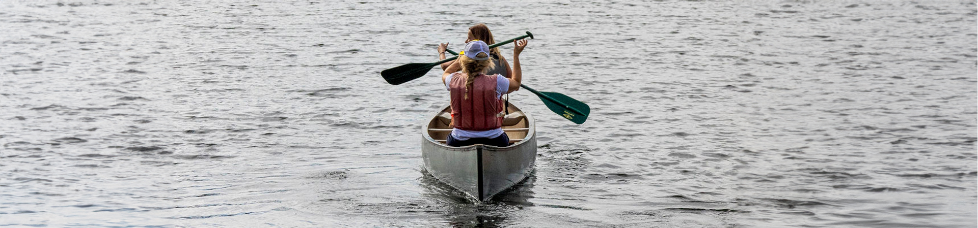  two women canoeing on Lake Brimhall 